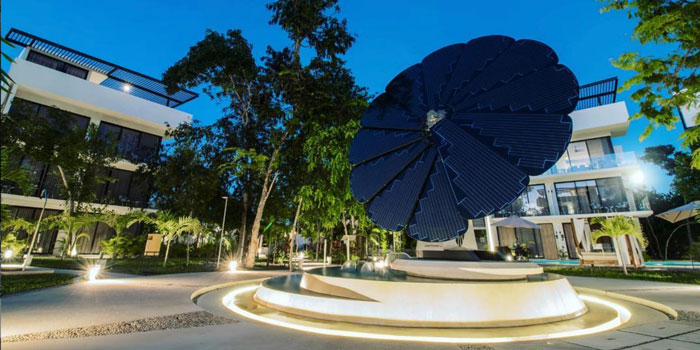 A SmartFlower Solar Panel Sits in the Middle of a Fountain Outside a Business Complex