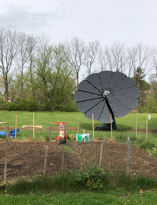 The SmartFlower Solar Panel Overlooks a Small Gardening Patch in the Midwest