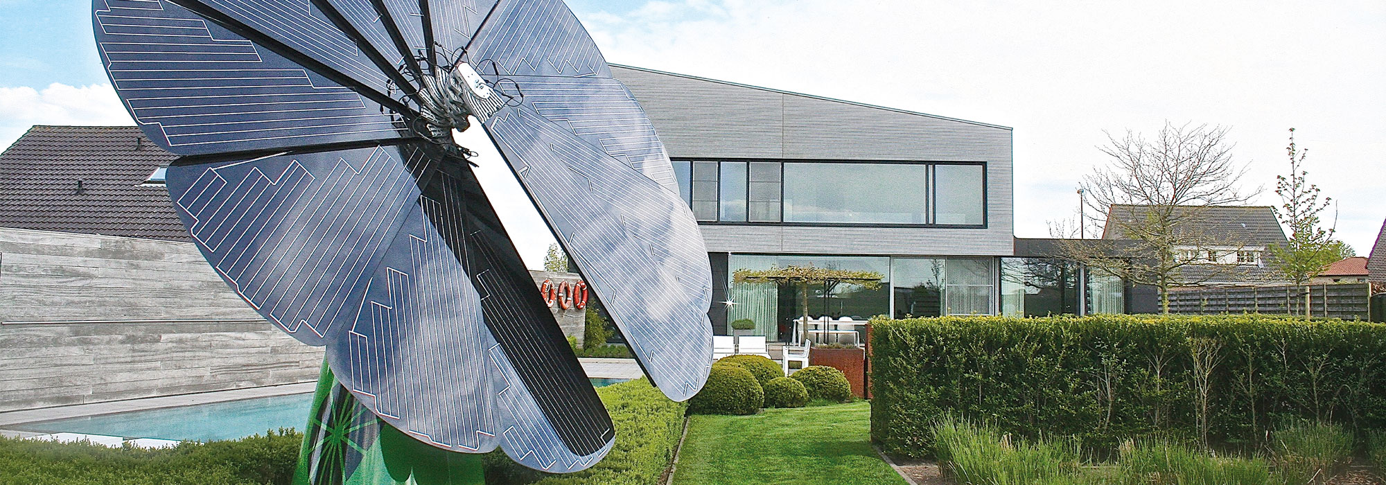 One SmartFlower Solar Panel Stands Outside a Family Home