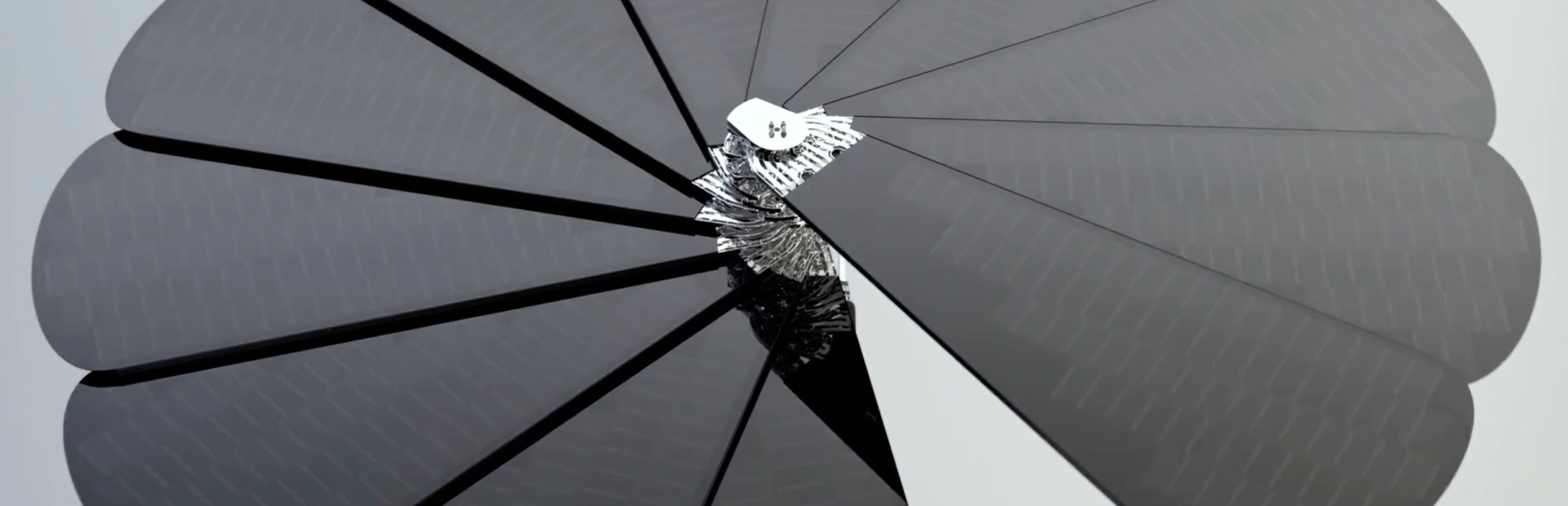 Top-down closeup of SmartFlower solar panel showing petal symmetry and mechanical rotation hub