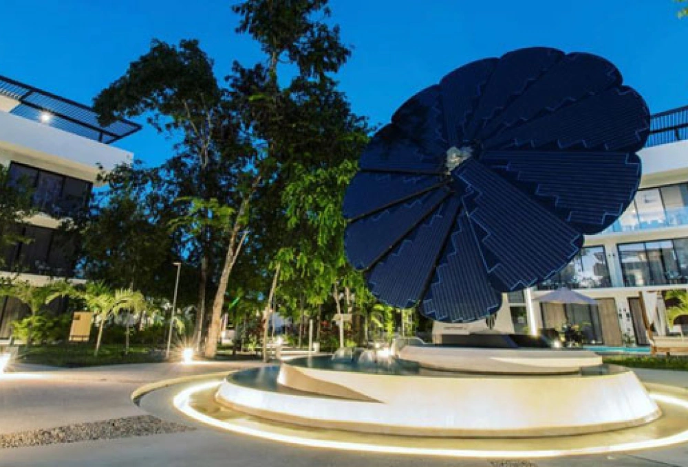 SmartFlower solar panel installation in a modern resort or hotel courtyard